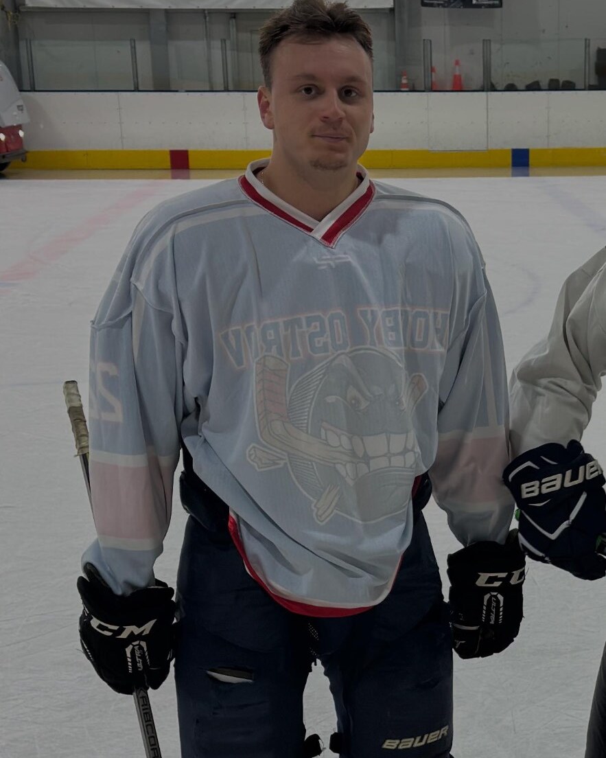Founder of Try Body Reset in hockey gear on the ice